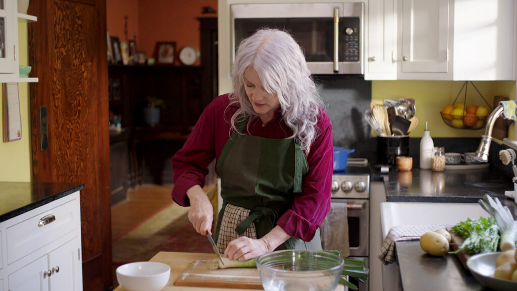 Maggie cooks in the kitchen